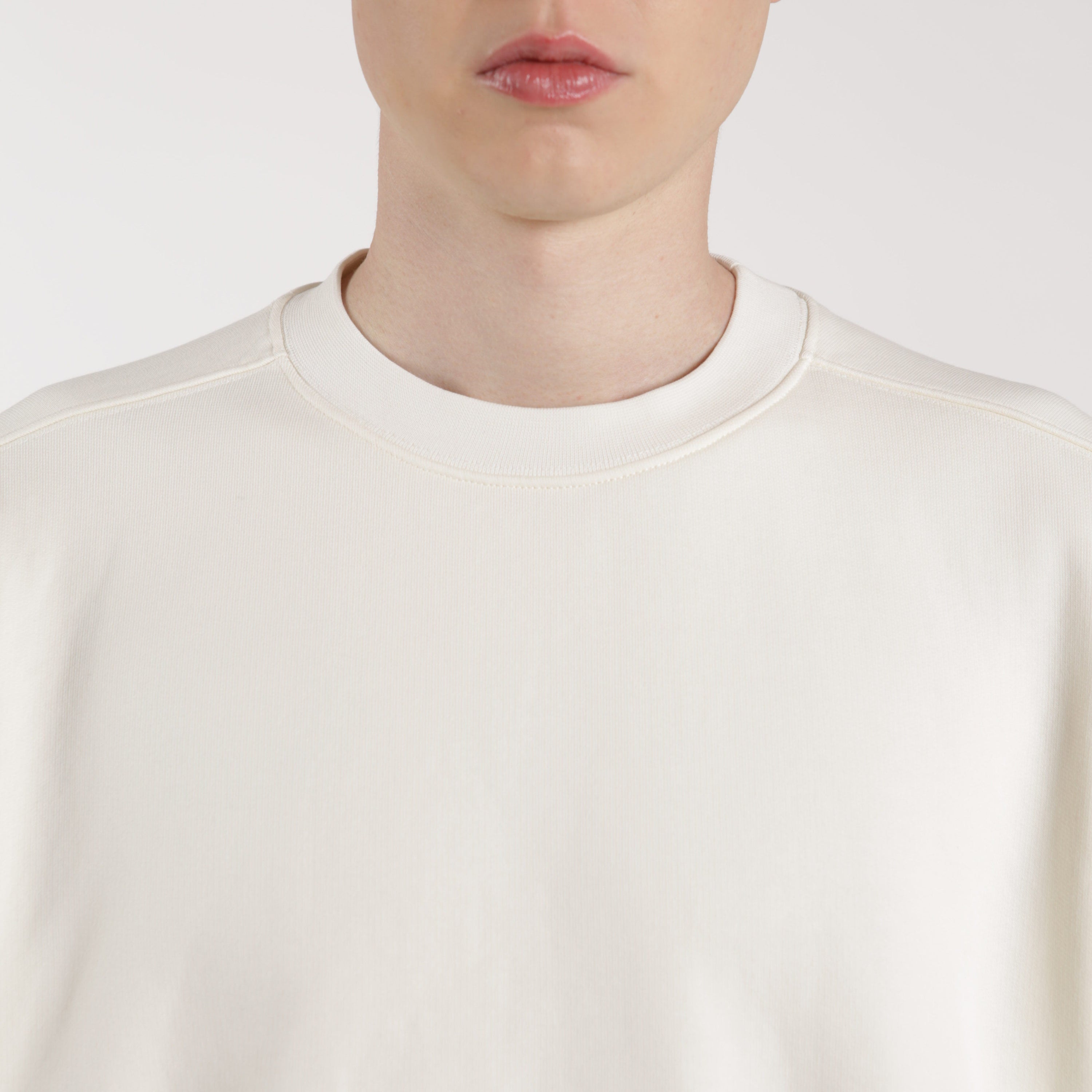 Detail view of high quality fleeceback crewneck by ArchesGlobal.co, premium merch blank.